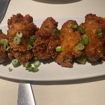 Table at Poipu - Chicken wings in a siracha glaze. Very good and not too spicy. - New American Near Me - Koloa, Hawaii