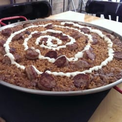 Can Bigotis - Arroz de montaña, con costillas de cordero, butifarra y allioli gratinado