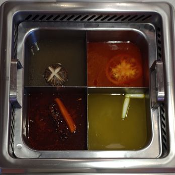Palace Tang - Broths from top left then clockwise... Mushroom, Tomato, Spicy & Sour, Medium Spicy - Hot Pot Near Me - Ann Arbor, Michigan