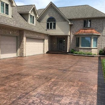 Deccon Concrete Restoration - a house with a driveway - General Contractors Near Me - Macomb, Michigan
