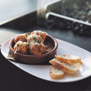 AC Sky Bar - Small Plate - Meatball Cazuela with Baba Ganoush and Parmesan Cheese - Bars Near Me - Orlando, Florida AC Sky Bar - Small Plate - Meatball Cazuela with Baba Ganoush and Parmesan Cheese - Bars Near Me - Orlando, Florida