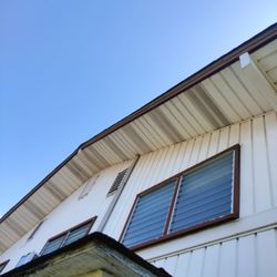 Dano’s Cleaning Service - Picture before pressure washing outside wall