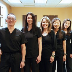Dr. Paul M. Lee with his staff.