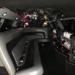 Russell Limousine - It has a party atmosphere w/fiber optics on the bar, ceiling, & partition that change colors & two rare "fireworks" displays!