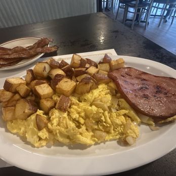 Blue Star Grill - Scrambled eggs with onion, home fries, ham and bacon - Burgers Near Me - High Springs, Florida Blue Star Grill - Scrambled eggs with onion, home fries, ham and bacon - Burgers Near Me - High Springs, Florida