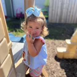 Little Cubs Learn and Play Daycare - Up the slide we go ! I love to play on the slides .