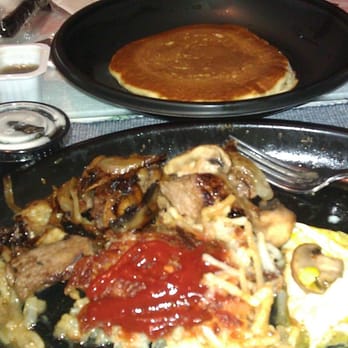 IHOP - NYE breakfast: Sirlion tip with grill onions & mushrooms, hashbrowns, eggs over easy & 3 buttermilk pancakes - American Near Me - Seattle, Washington