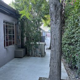 Horrid "patio" at back of property, all other rooms have patio or chairs outside the rooms in the lovely pool-side courtyard. Horrid "patio" at back of property, all other rooms have patio or chairs outside the rooms in the lovely pool-side courtyard.