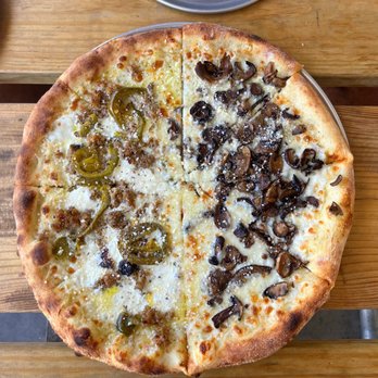 Sidewall Pizza - Half "Spicy Italian" and half "Roasted Mushrooms" pizza on a garlic based sauce - Pizza Near Me - Simpsonville, South Carolina
