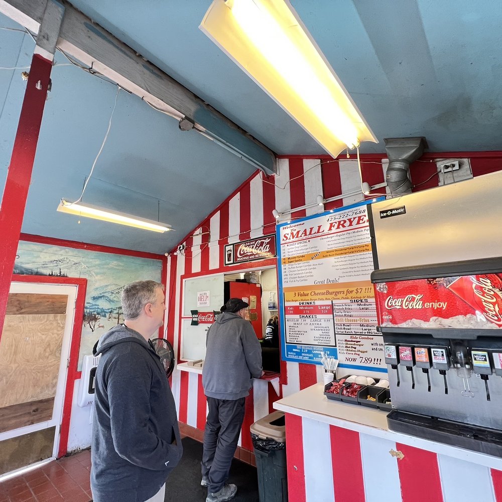 Small Fryes - a man and a woman standing in front of a counter - Burgers Near Me - Fall City, Washington Small Fryes - a man and a woman standing in front of a counter - Burgers Near Me - Fall City, Washington