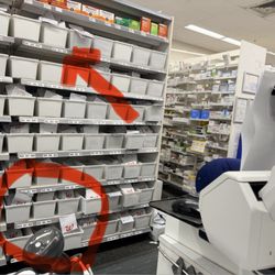 Walgreens - They looked in all the boxes circled and I found it in the box with the arrow from the distance standing behind the counter