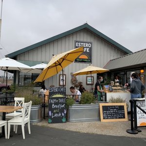 Photo of Estero Cafe - Valley Ford, CA, United States. Estero Cafe with outdoor tables along street.