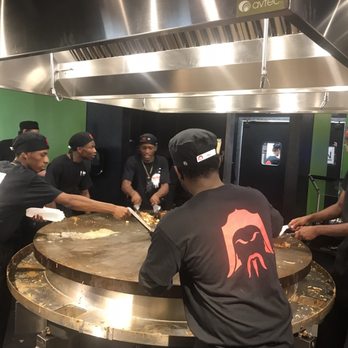HuHot Mongolian Grill - Hot action shot! - Asian Fusion Near Me - West Allis, Wisconsin