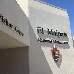 El Malpais National Monument Visitor Center - Front entrance. Neely paved parking lot. Plenty of RV parking spaces.