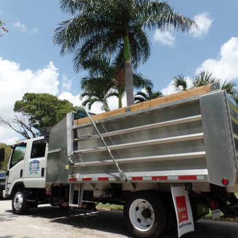 Mitch Lawn Service - a garbage truck parked on the side of the road - Tree Services Near Me - Plantation, Florida Mitch Lawn Service - a garbage truck parked on the side of the road - Tree Services Near Me - Plantation, Florida
