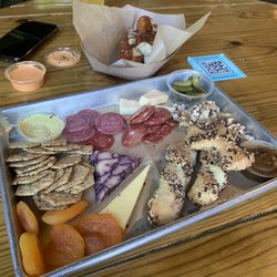 HiHO Brewing Co. - Charcuterie and pretzels behind them.