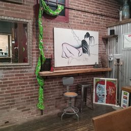 a brick wall with a painting on it a brick wall with a painting on it