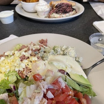 Chompie's - Cobb salad, pastrami sandwich, potato salad and wedges. - Delis Near Me - Glendale, Arizona