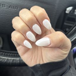Uneven coats and bubbles on middle nail.