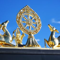 Kadampa Meditation Center - Deer and Dharma wheel above entrance.