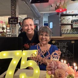 Waitress with the birthday girl.