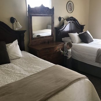 Hotel Wolf - The tall beds - very comfy! - Hotels Near Me - Saratoga, Wyoming