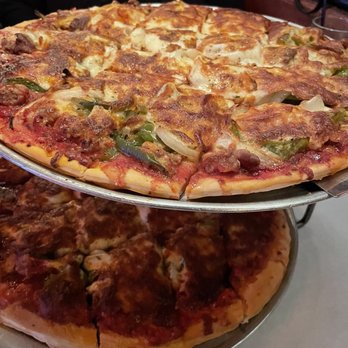 Salerno's On the Fox - Top pizza is the thin version with sausage, green peppers and onions. - Italian Near Me - St. Charles, Illinois Salerno's On the Fox - Top pizza is the thin version with sausage, green peppers and onions. - Italian Near Me - St. Charles, Illinois