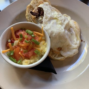 B Matthews Eatery - Chicken N biscuit with a side of grits. The biscuit was amazing! The grits were okay they didn't have much flavor without the toppings - New American Near Me - Savannah, Georgia