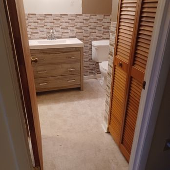 MD's Home Remodeling - After picture of bathroom completed. (New vanity) and (new flooring) - Drywall Installation & Repair Near Me MD's Home Remodeling - After picture of bathroom completed. (New vanity) and (new flooring) - Drywall Installation & Repair Near Me