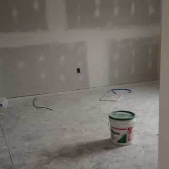 Glosemeyer Renovation Solution - a bucket of paint on the floor - General Contractors Near Me