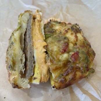 Einstein Bros. Bagels - Green chili bagel with salsa smear, egg, pork patty. - Breakfast & Brunch Near Me - Georgetown, Texas Einstein Bros. Bagels - Green chili bagel with salsa smear, egg, pork patty. - Breakfast & Brunch Near Me - Georgetown, Texas