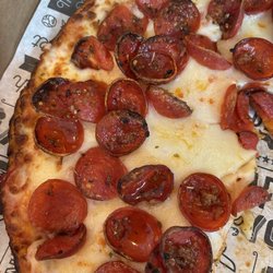 Blackstone Pizza and Salad - Pepperoni pizza.