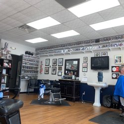 Forest Hills Barber Shop - Rob, art collection, and overall a cool atmosphere to get your haircut at.