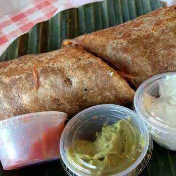 Tapsilog Bistro - Adobo burrito, fries meat lumpia and an a sunny side egg. An salsa guac and sour cream on the side. The most meatiest tastin burrito - Filipino Near Me - Campbell, California