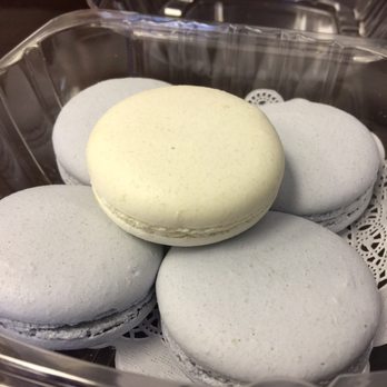 Rommy - A vanilla bean macaron sitting on a bed of Taro macaroons. Yummy! - Coffee & Tea Near Me - Rochester Hills, Michigan Rommy - A vanilla bean macaron sitting on a bed of Taro macaroons. Yummy! - Coffee & Tea Near Me - Rochester Hills, Michigan