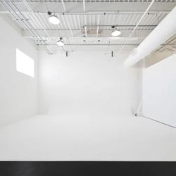 Image Studios - 25' wide white infinity cyc wall with 13' ceilings & ceiling I-beams for mounting lighting, swings, aerial silks & rigs.