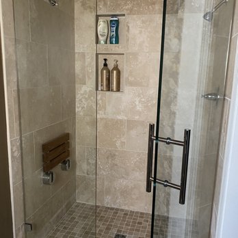 Midwest Flooring - a shower with a glass door - Flooring Near Me - Perry, Kansas