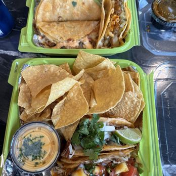 D A Taste - Top -- beef birria, blackened lobster, Nashville hot, Bottom - jerk chicken and beef birria tacos with chips and smoked queso - Tacos Near Me - Buffalo, New York