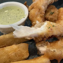 Juicy tempura-beer-battered fish of day (snapper) with yuca "chips" and cilantro dipping sauce ($21). Juicy tempura-beer-battered fish of day (snapper) with yuca "chips" and cilantro dipping sauce ($21).