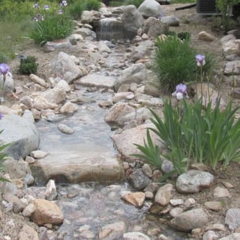 Premier Landscapes - a stream running through a garden - Landscaping Near Me - Layton, Utah