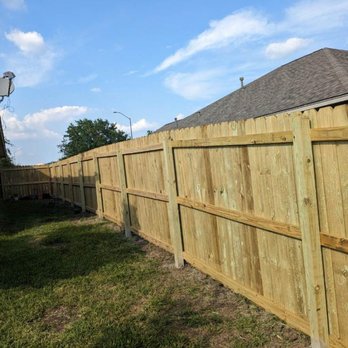 Holy touch Handyman - a wooden fence in a backyard - Handyman Near Me Holy touch Handyman - a wooden fence in a backyard - Handyman Near Me