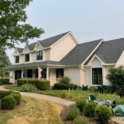After: Black windows and white siding is sharp.