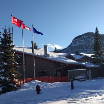 HI-Banff Alpine Centre - Exterior view of main hostel building. - Hotels Near Me - Banff, Alberta