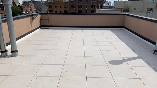 Porcelain Roof Pavers Installation - Verrazano Roofing is a licensed contractor serving the New York City area for over 30 years. Verrazano specializes in both commercial and residential shingle, flat, TPO, cold and hot process roofing. Verrazano works with the top roofing suppliers in New York, giving their clients the best results. Product vendors include Firestone, Johns Menville, and Kemper process. Porcelain Roof Pavers Installation - Verrazano Roofing is a licensed contractor serving the New York City area for over 30 years. Verrazano specializes in both commercial and residential shingle, flat, TPO, cold and hot process roofing. Verrazano works with the top roofing suppliers in New York, giving their clients the best results. Product vendors include Firestone, Johns Menville, and Kemper process.