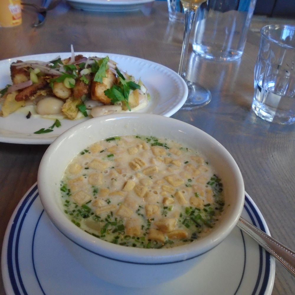 The Salt Line - Ballston - Cup of Clam Chowder (front); Crispy Octopus (back) - Seafood Near Me - Arlington, Virginia The Salt Line - Ballston - Cup of Clam Chowder (front); Crispy Octopus (back) - Seafood Near Me - Arlington, Virginia