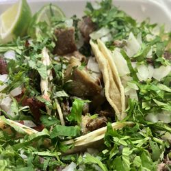 Taqueria Guelaguetza - Carnitas with an odd tinted sheen, typically when meat is reheated.