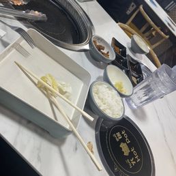 Table setting: ckn nuggets, kimchi, rice bowl and sauce Table setting: ckn nuggets, kimchi, rice bowl and sauce