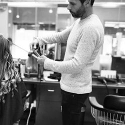 Our hair designer, Ozzy, in deep focus is to create a style for his clients that uniquely compliments their aesthetic.