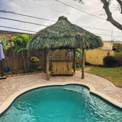 Oasis Tiki Huts - Tiki hut and bar