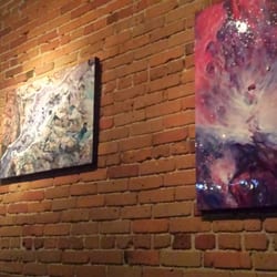 The Italian Kitchen - Cozy spot with exposed brick wall and unique artwork for sale near the front of the restaurant